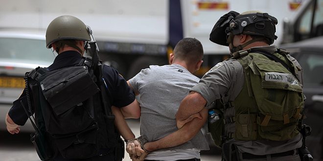 Israeli occupation forces arrest a Palestinian in Ramallah